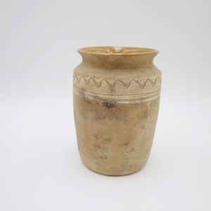 Handmade clay pot in tan.